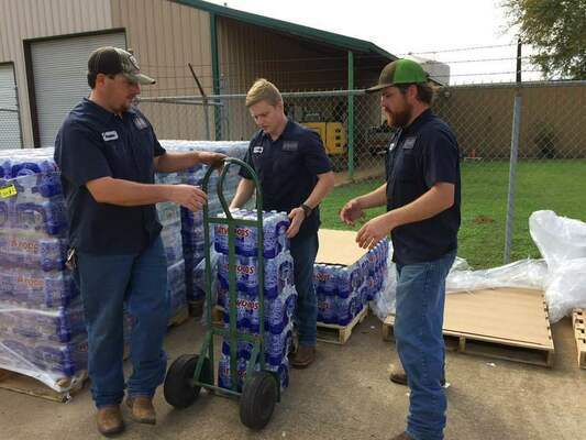 Craft-Turney field personnel get ready to distribute bottles of water to customers affected in the do not use water notice issued by the TCEQ today.
Photo by John Hawkins