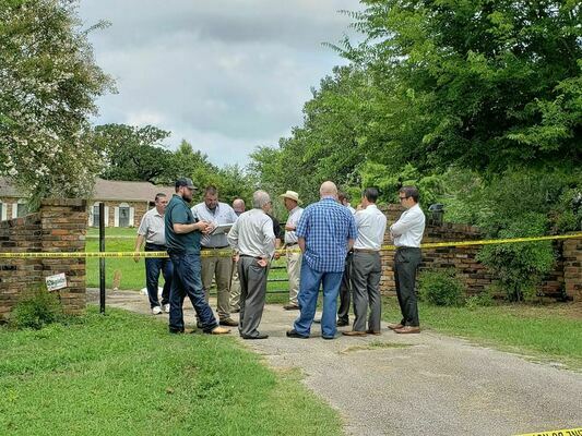 Quadruple homicide – Members of the Cherokee County Sheriff’s Department gather at the front gate of a residence approximately 2.0 miles north of the New Summerfield city limits along Texas Highway 110 that was the scene of an early-morning quadruple homicide on July 20. Names of the victims have not been released, pending contact of family members. A search continues for the suspect(s). 

Photo by Jo Anne Embleton