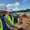 Joe Penick, on-site project manager, right, provides detail of groundwork done on a new patient complex at the 102-year-old hospital; below, an aerial shot of the new admin building.

Photo by Jo Anne Embleton