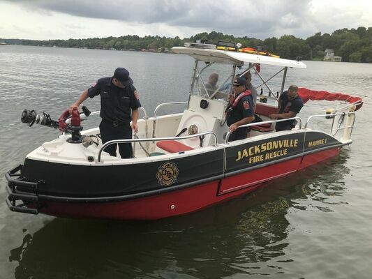 Members of the Jacksonville Fire Department train with the department’s new fireboat on Lake Jacksonville.