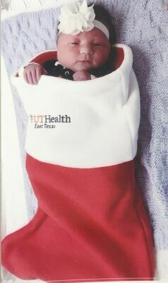 Amelia Lynn Rodriguez models her holiday stocking from UT Health – Jacksonville

Courtesy photo