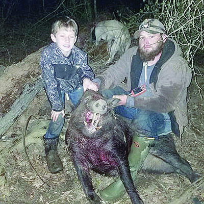 Courtesy photo
Jesse and Randal Grimes bag a feral hog in a hunt this time last year. Jesse is now battling liver cancer.