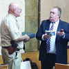 Photo by Cristin Parker
County Judge Chris Davis wishes Sheriff James Campbell a fond farewell with gifts honoring his career as the longest serving sheriff in the county’s history, during Tuesday’s commissioners court meeting.