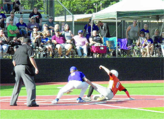 Photo by Michelle Dillon


WHS Pirate No. 6 Logan Tucker slides across home plate to score one of the three runs in game two of the Regional playoffs against the LaPoynor Flyers.