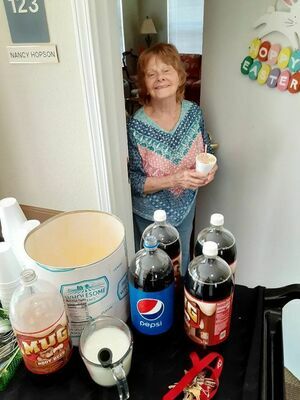 A resident of Jacksonville’s Angelia House enjoys a rootbeer float treat this month.