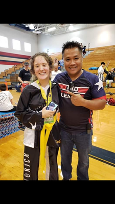 Alto ISD student Cassie Wallace poses for a photo with Texas Karate Organization (TKO) League World Champion Wayne Nguyen, founder of the TKO League.