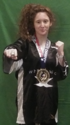 Photos courtesy of Wayne Chancellor
State Karate Champion Cassie Wallace shows off her form and her championship ring and medal after winning her division in the 21st annual Martial Arts Expo and State finals last month.