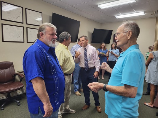 Sam Hopkins (right) chats with Flowers. Hopkins served on the Appraisal District board of directors for several years

Jo Anne Embleton/Cherokeean Herald